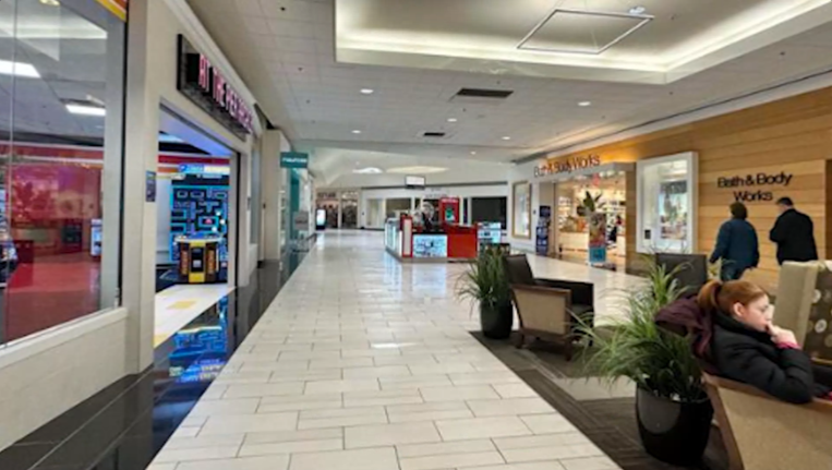 Empty interior corridor of Aviation Mall in Queensbury, New York, with closed storefronts